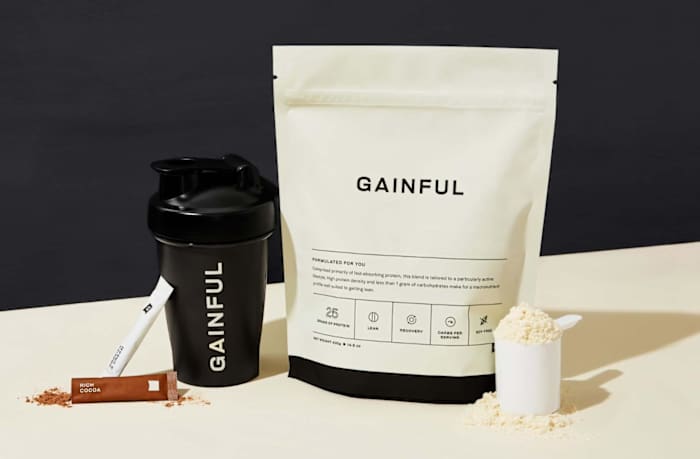 A bag of Gainful protein powder next to a shaker bottle