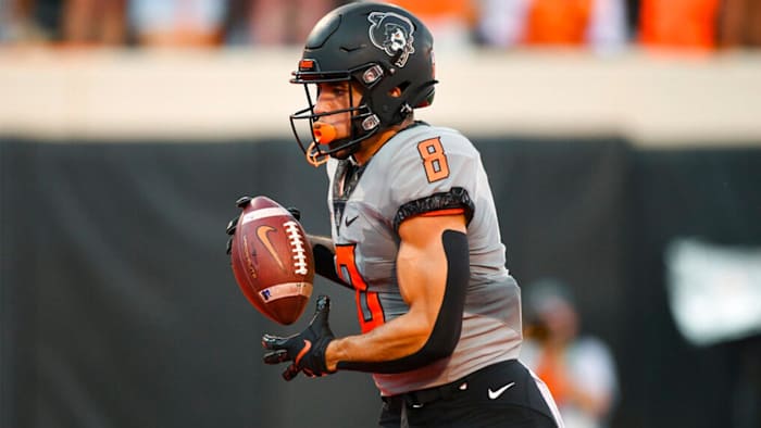 Oklahoma State wide receiver Braydon Johnson (8) runs for a touchdown during the first half of an NCAA college football game against Arkansas-Pine Bluff, Saturday, Sept. 17, 2022, in Stillwater, Okla. (AP Photo/Brody Schmidt)