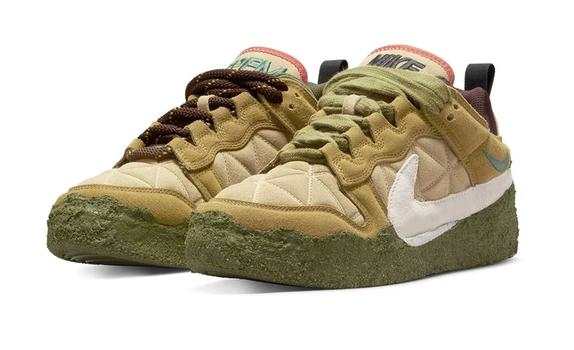 Tan and green Nike Dunk shoes.