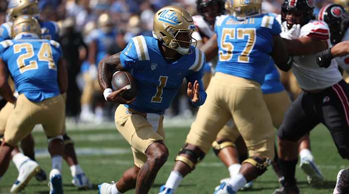 Oct 8, 2022; Pasadena, California, USA; UCLA Bruins quarterback Dorian Thompson-Robinson (1) runs with a ball during the first quarter against the Utah Utes at Rose Bowl.