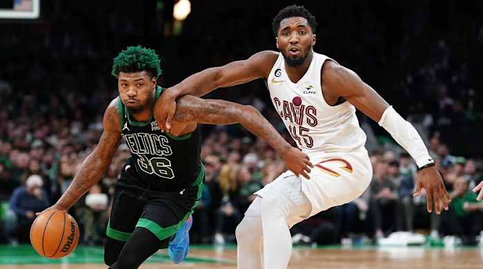 Oct 28, 2022; Boston, Massachusetts, USA; Cleveland Cavaliers guard Donovan Mitchell (45) defends against Boston Celtics guard Marcus Smart (36) in the second half at TD Garden.