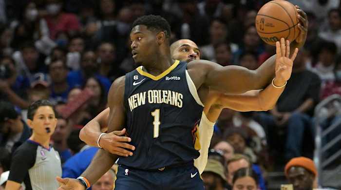 Oct 30, 2022; Los Angeles, California, USA; New Orleans Pelicans forward Zion Williamson (1) keeps the ball out of reach of Los Angeles Clippers forward Nicolas Batum (33) in the second half at Crypto.com Arena.