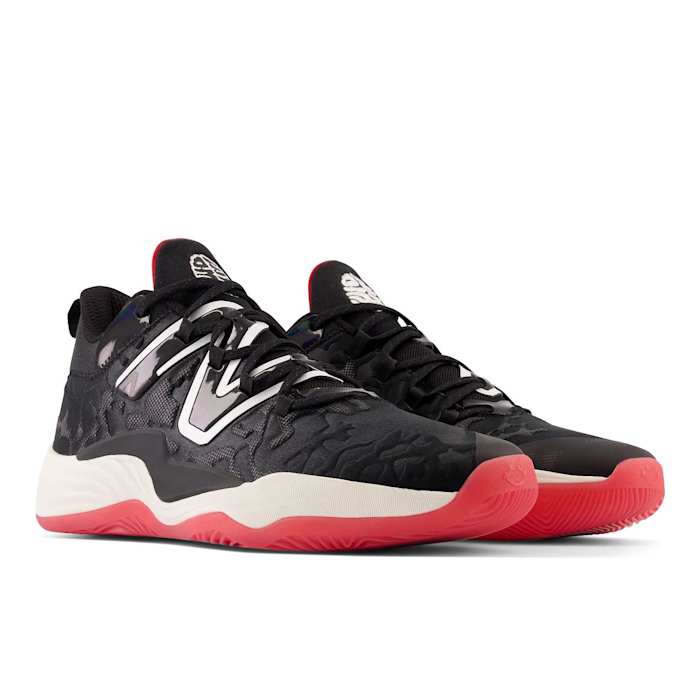 View of black, white, and red New Balance shoes.