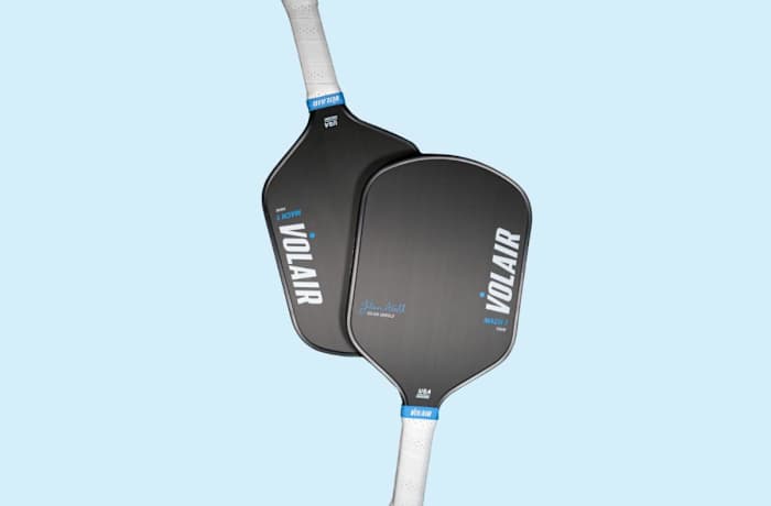 Two Volair Mach 1 paddles with white handles and a black hitting surface, one overlapping the other. Our top pick for the best pickleball paddle for intermediate players.