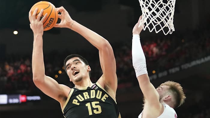 Purdue Boilermakers center Zach Edey rebounds against Wisconsin.