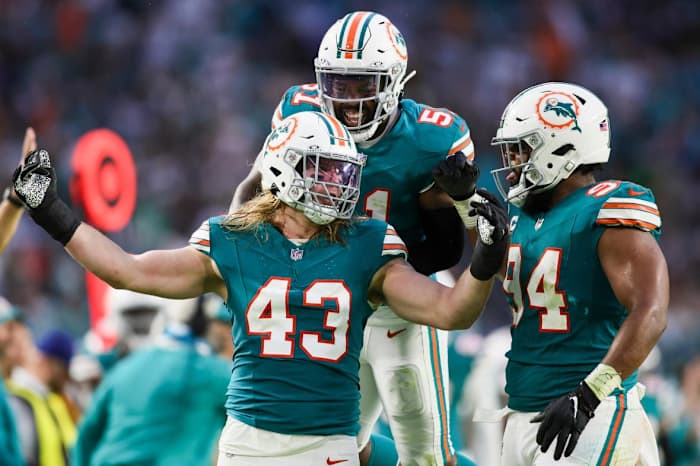 Miami Dolphins linebacker Andrew Van Ginkel (43) celebrates with defensive tackle Christian Wilkins (94) and linebacker David Long Jr. (51) after a play against the Dallas Cowboys during the second quarter at Hard Rock Stadium.