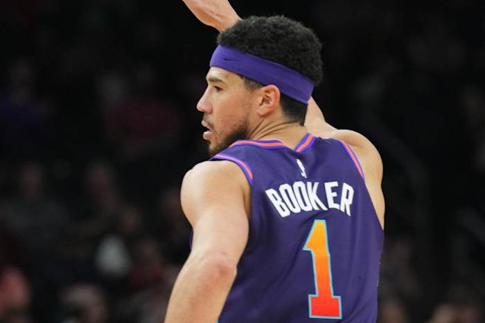 Phoenix Suns guard Devin Booker (1) reacts against the Houston Rockets during the second half at Footprint Center.