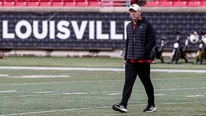 Louisville head football coach Jeff Brohm watches drills at L&N Federal Credit Union Stadium