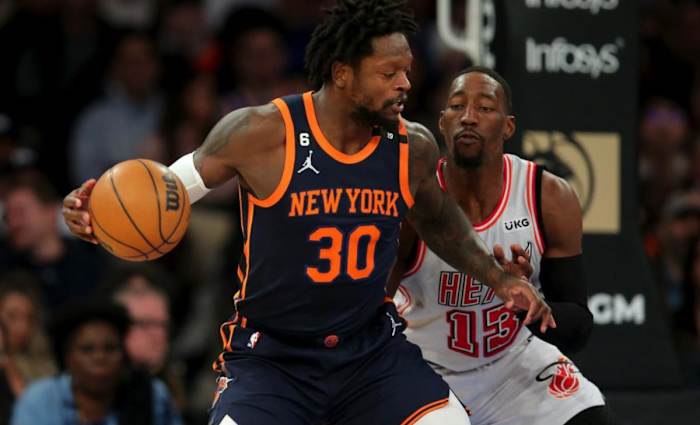 New York Knicks forward Julius Randle backs down Miami Heat center Bam Adebayo