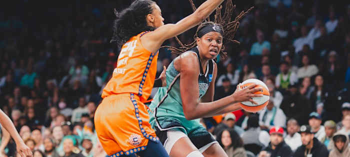 Jonquel Jones (R) earned yet another double-double in Sunday afternoon's Finals berth-clinching victory.