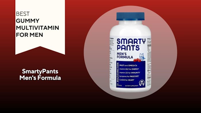 A bottle SmartyPants Men's Formula gummy multivitamin against a red background