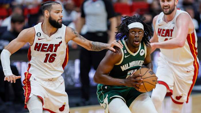 Milwaukee Bucks guard Jrue Holiday drives against Miami Heat forward Caleb Martin