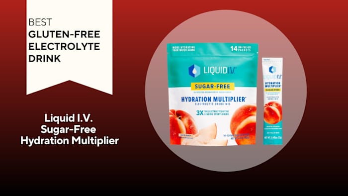 A red background with a banner reading "Best Gluten-Free Electrolyte Drink" next to a turquoise and white bag of peach-flavored Liquid I.V. sugar-free Hydration Multiplier electrolyte drink