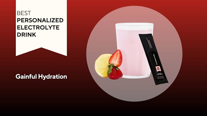 A red background with a banner reading "Best Personalized Electrolyte Drink" next to a glass of pink strawberry lemonade Gainful Hydration beverage and a black packet of Gainful Hydration electrolyte powder