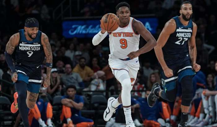 RJ Barrett (center) had a busy Saturday night for the Knicks 