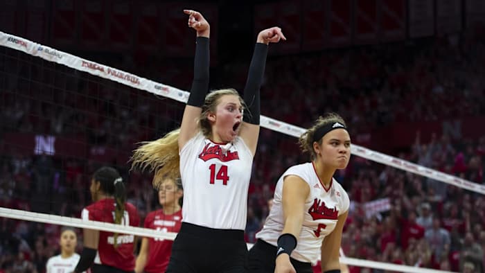 Ally Batenhorst (14) and Bekka Allick (15) celebrate a point against Wisconsin. (Nov. 25, 2022)
