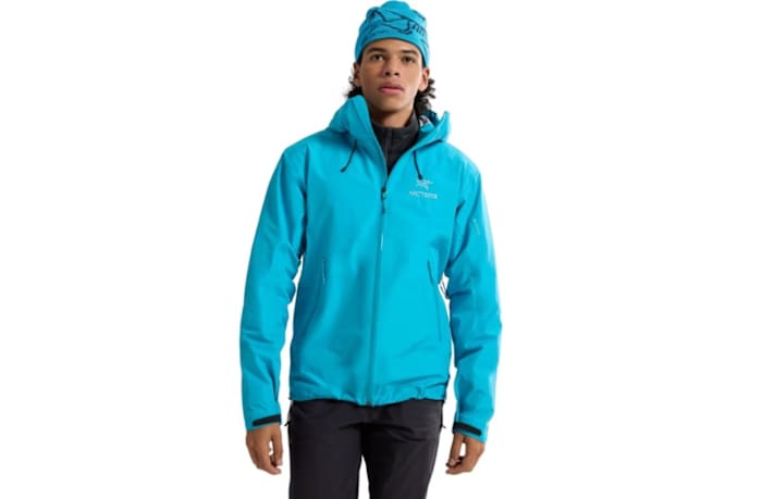 A man wearing an Arc'teryx beta lt jacket in blue