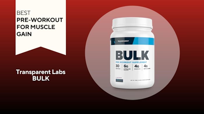 A red background with a white banner reading "Best Pre-Workout for Muscle Gain" next to a white and navy container of Transparent Lab BULK Pre-Workout in Sour Grape flavor