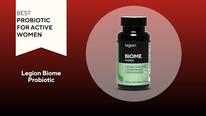 A red background with a white banner that says, "Best Probiotic for Active Women" next to a black and green bottle of Legion Biome Probiotic