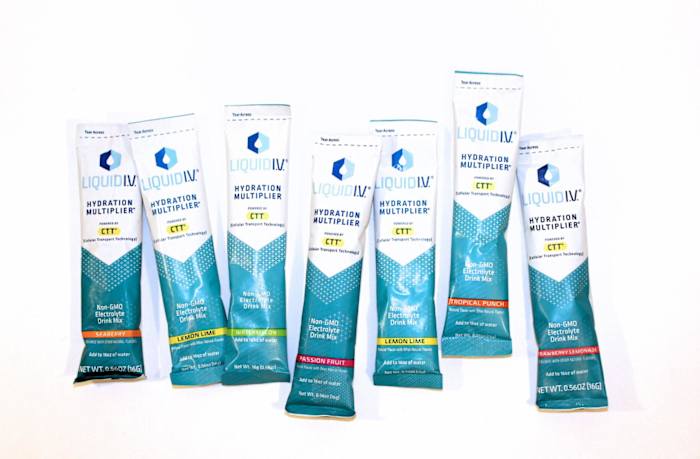 Liquid IV electrolyte travel packs in various flavors against a white background