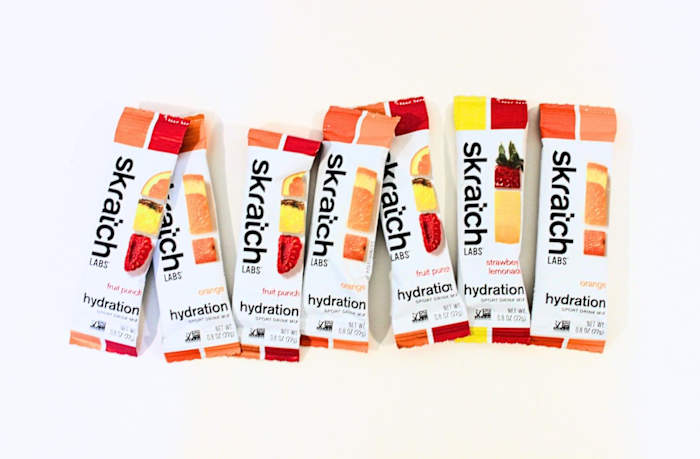 Skratch Labs hydration electrolyte travel packets in various flavors against a white background