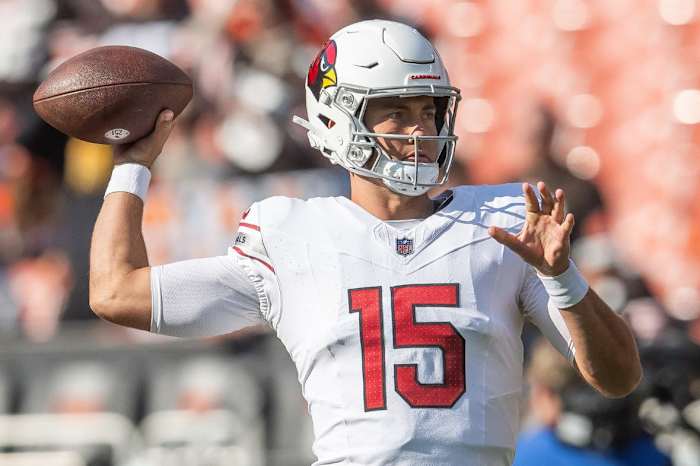 Arizona Cardinals quarterback Clayton Tune (15) warms up before the game between the Cardinals and the Cleveland Browns at Cleveland Browns Stadium.