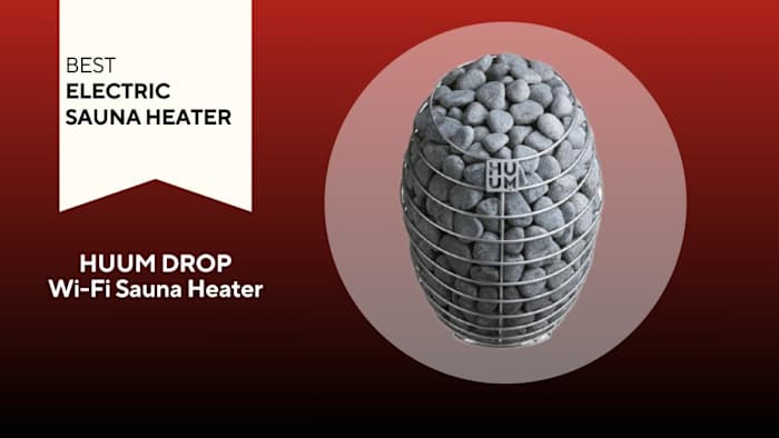 HUUM DROP Wi-Fi Sauna Heater — a wire basket holding grey stones