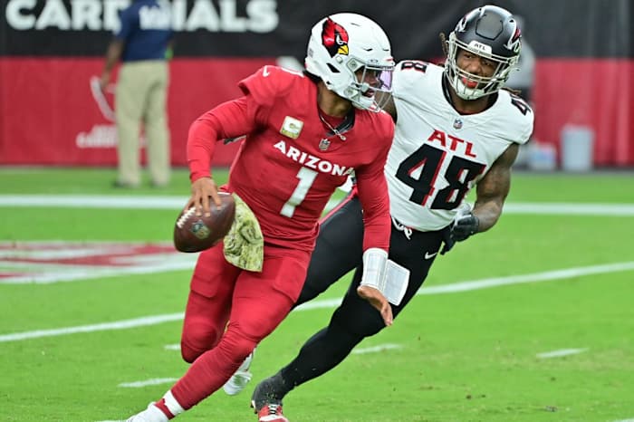 Arizona Cardinals quarterback Kyler Murray (1) is chased by Atlanta Falcons linebacker Bud Dupree (48) in the first half at State Farm Stadium.