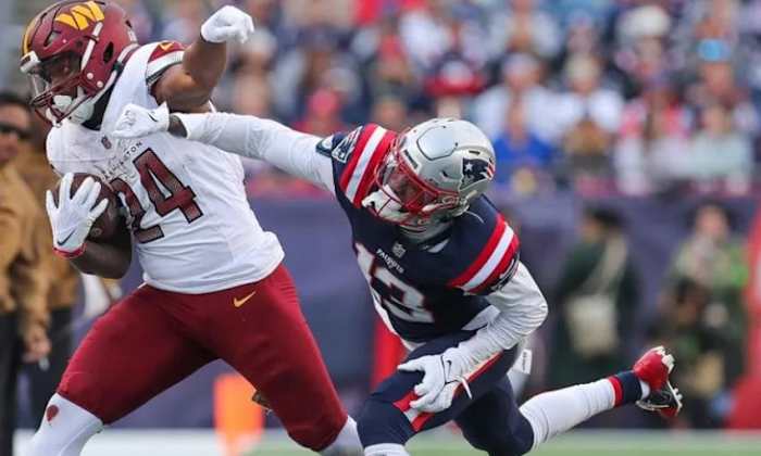 Jones (in blue) seen during New England's loss to Washington earlier this month