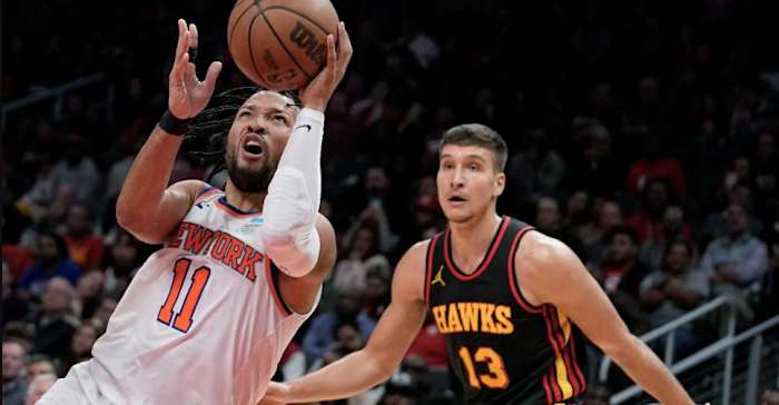 Jalen Brunson (11) did backcourt battle with Bogdan Bogdanović (13) on Wednesday in Atlanta