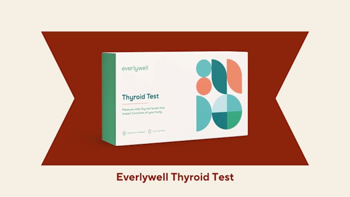 The Everlywell at home thyroid test kit against a red and beige background