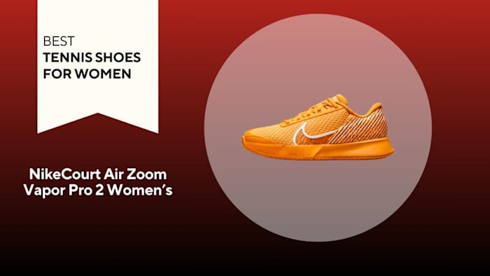 An image of an orange NikeCourt Air Zoom Vapor Pro 2 against a red background.