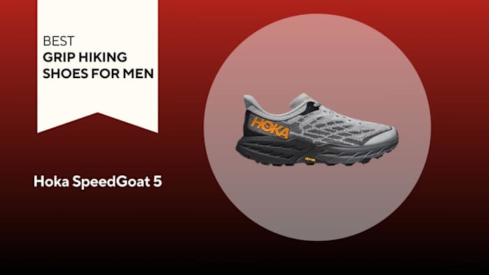 grey and orange hoka speedgoat 5 shoe on red background