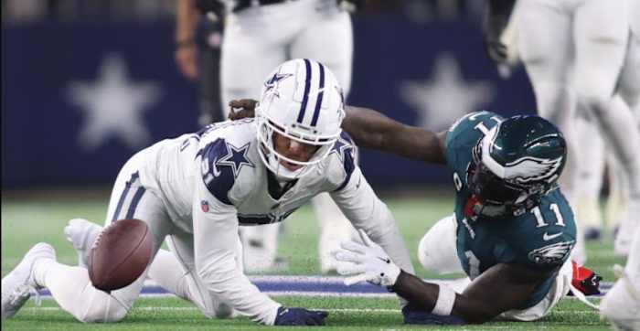 Gilmore (L) goes for the fumble he forced from Brown during third quarter action on Sunday
