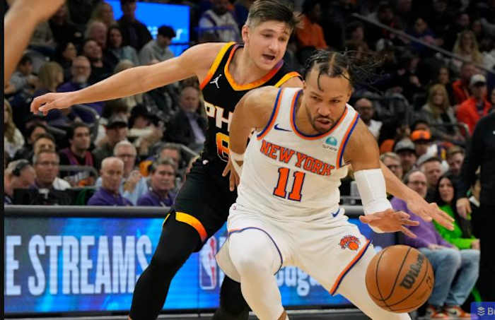 Brunson dribbles against Grayson Allen during Friday's win