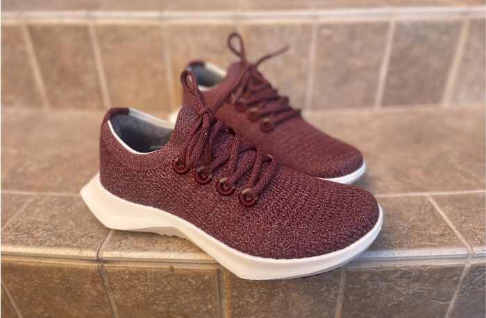 maroon allbirds tree dasher 2 on tile flooring