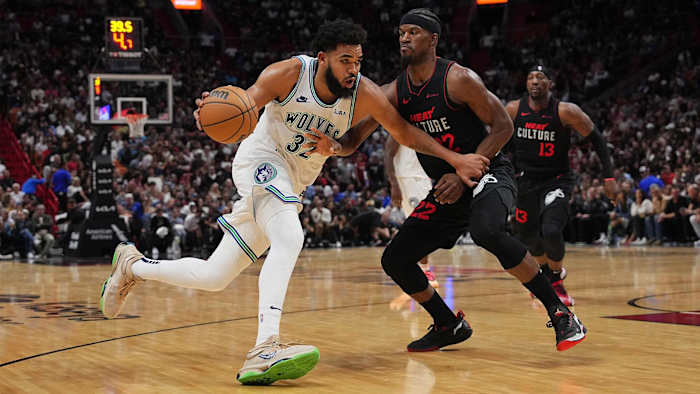 Minnesota Timberwolves center Karl-Anthony Towns drives the ball around Miami Heat forward Jimmy Butler