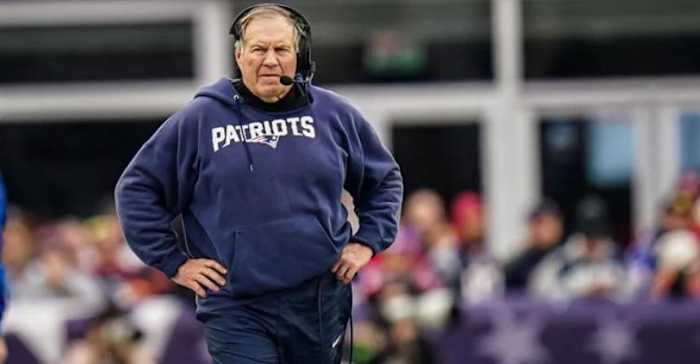 Bill Belichick coaching on the sideline.