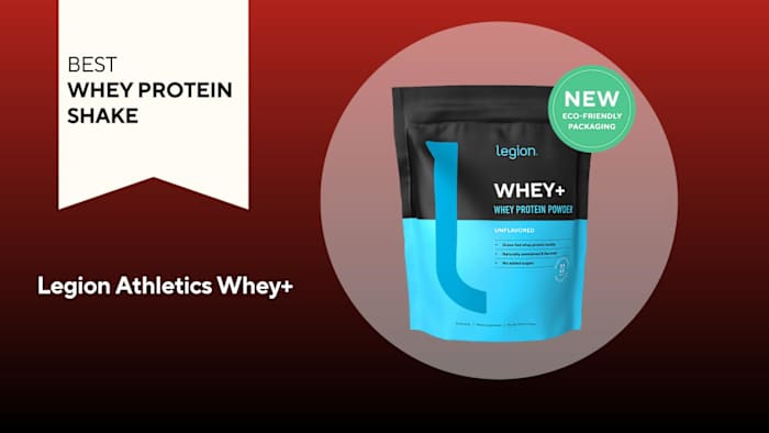 A black and blue bag of legion athletics whey+ against a red background, our pick for the best whey protein shake