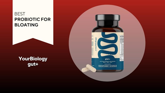 A brown container with blue writing on a red background of YourBiology gut+, our pick for the best probiotic for bloating 