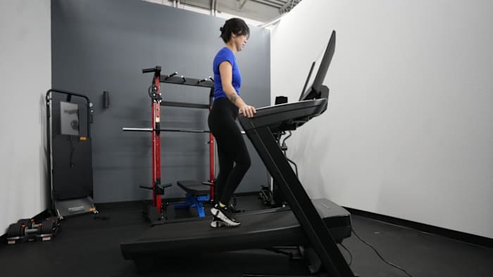 Woman walking on the NordicTrack 2450 incline