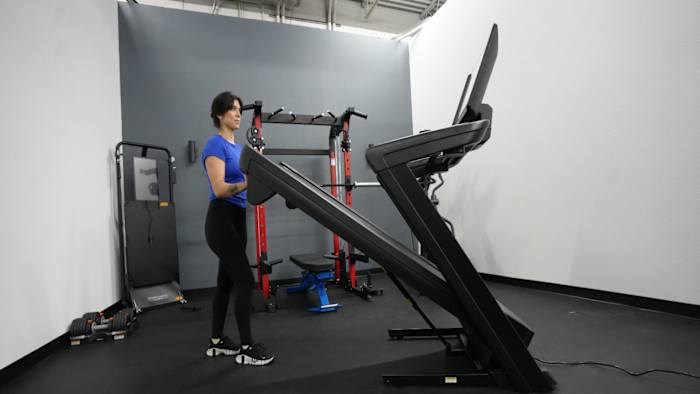 Woman folding up NordicTrack 2450