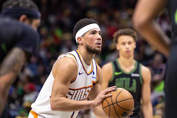 Phoenix Suns guard Devin Booker (1) shoots a free throw against the New Orleans Pelicans during the first half at Smoothie King Center.