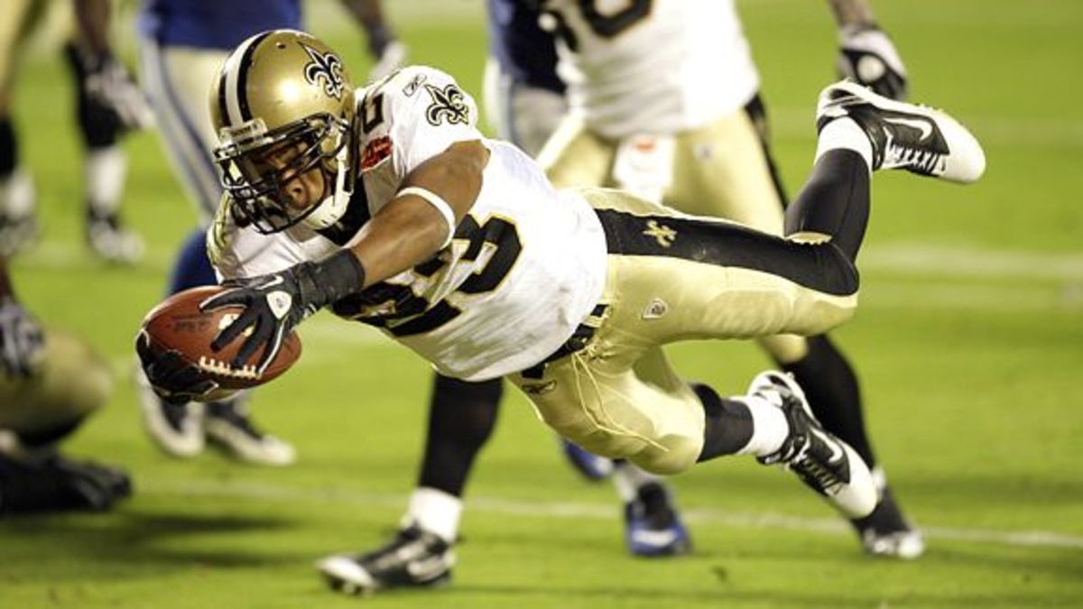  Feb 7, 2010 ; Miami Gardens, FL, USA; New Orleans Saints running back Pierre Thomas (23) dives across the goal line for a touchdown in the third quarter of Super Bowl XLIV at Sun-Life Stadium. The Saints defeated the Indianapolis Colts 31-17. Mandatory Credit: Matthew Emmons – US PRESSWIRE
