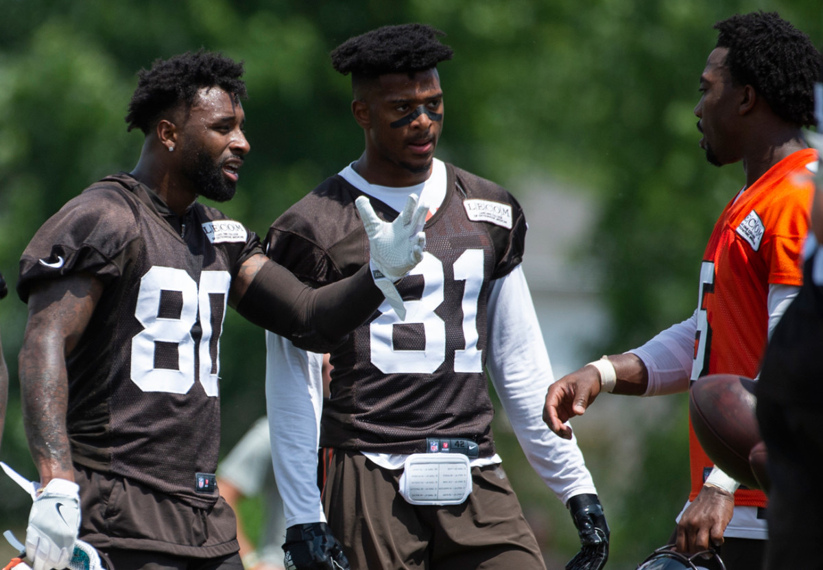 Landry and fellow receiver Rashard Higgins talk to Tyrod Taylor during minincamp.