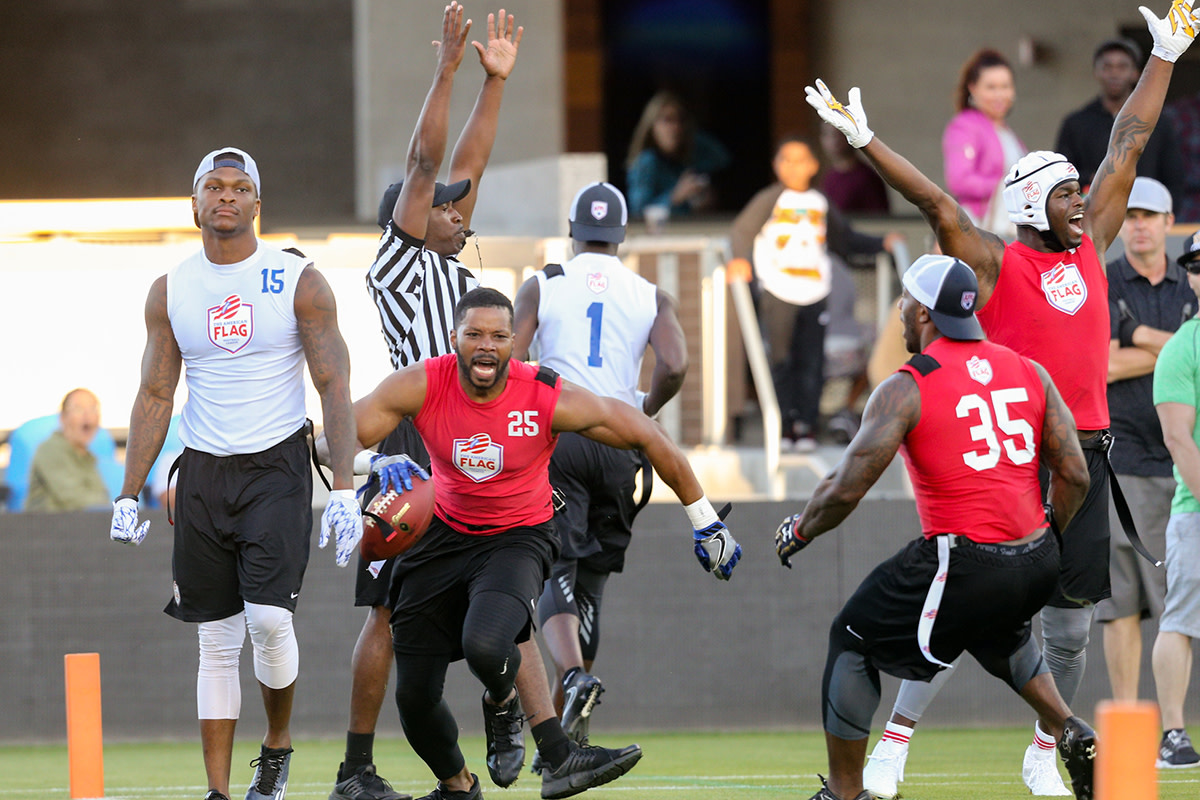 The NFL influences on the AFFL's pilot game were evident as Kerry Rhodes (25) and former Patriots RB Jonas Gray (35) celebrated a touchdown.