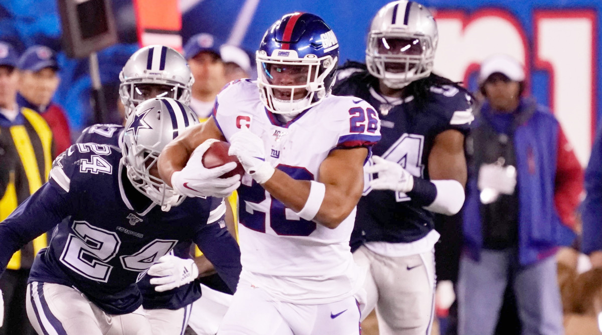 Nov 4, 2019; East Rutherford, NJ, USA; 
New York Giants running back Saquon Barkley (26) runs for a 65 yard 1st down ion the 4th quarter at MetLife Stadium. Mandatory Credit: Robert Deutsch-USA TODAY Sports