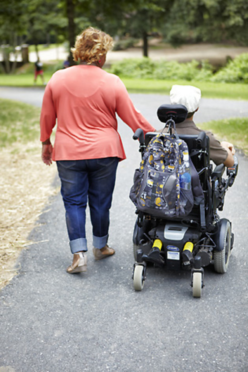 With G-Mom always there to help, Chancellor uses his wheelchair to get around and to compete in Special Olympics events.