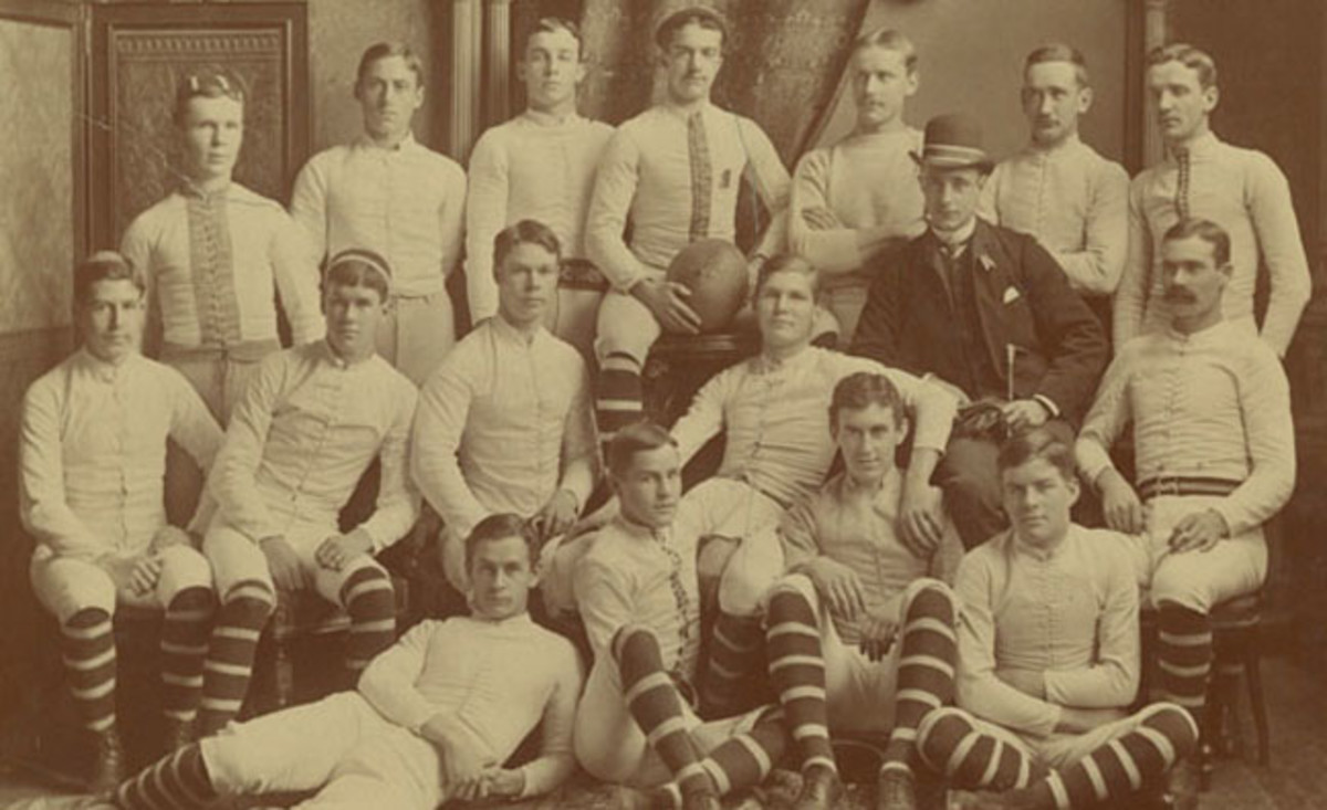 Naismith (center, far right) was a member of the football team when he attended McGill University. He is also often credited with being the inventor of the football helmet. 
