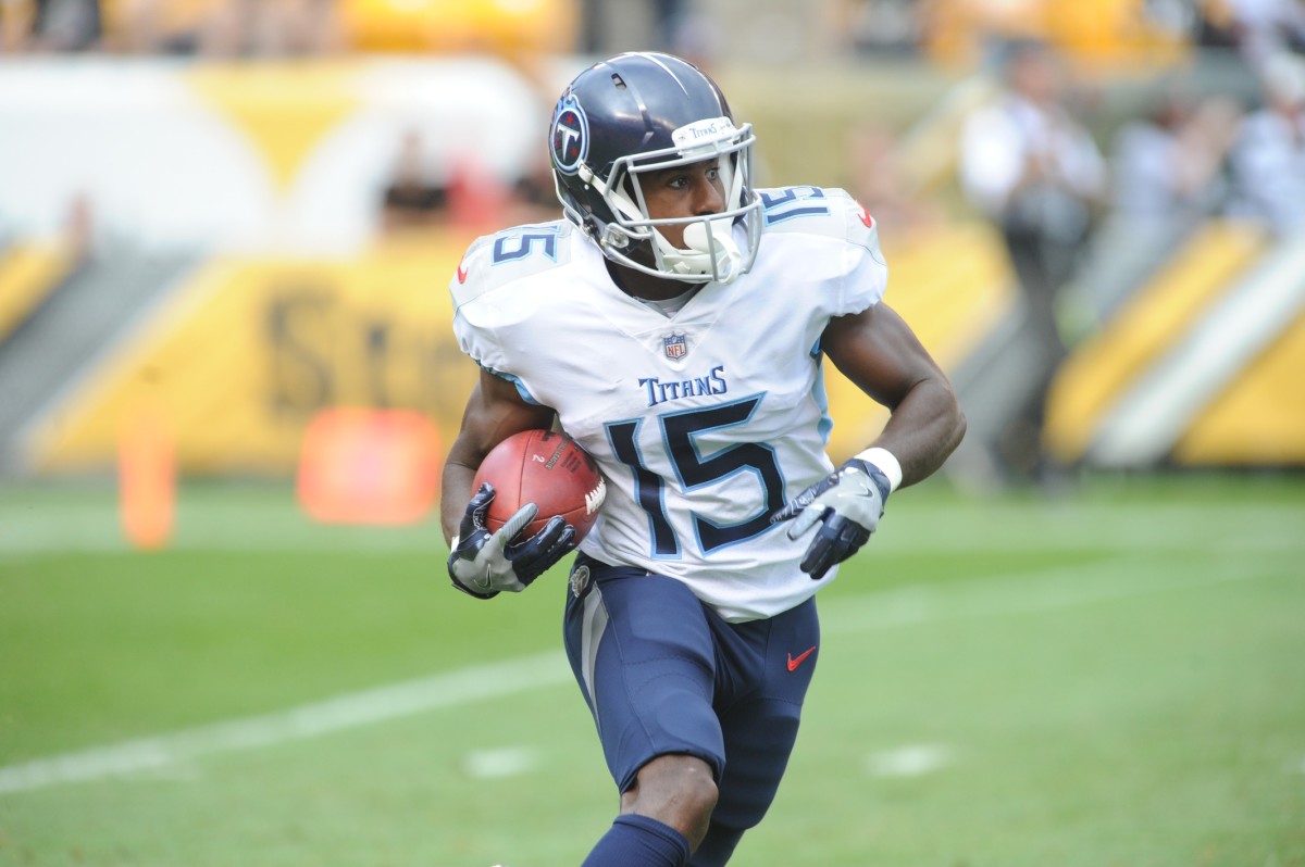 Tennessee Titans special teams player Darius Jennings (15) returns a second quarter kick against the Pittsburgh Steelers at Heinz Field.